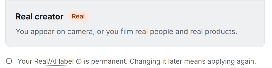 The creator application's Real creator choice, tagged Real, with the note that the label is permanent.
