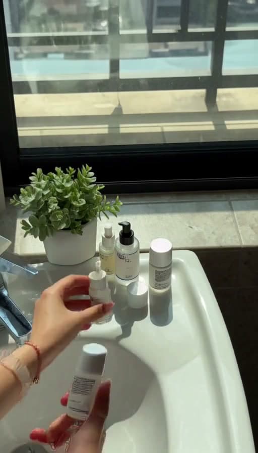 Preview of Serum patted onto bare cheeks, close-up