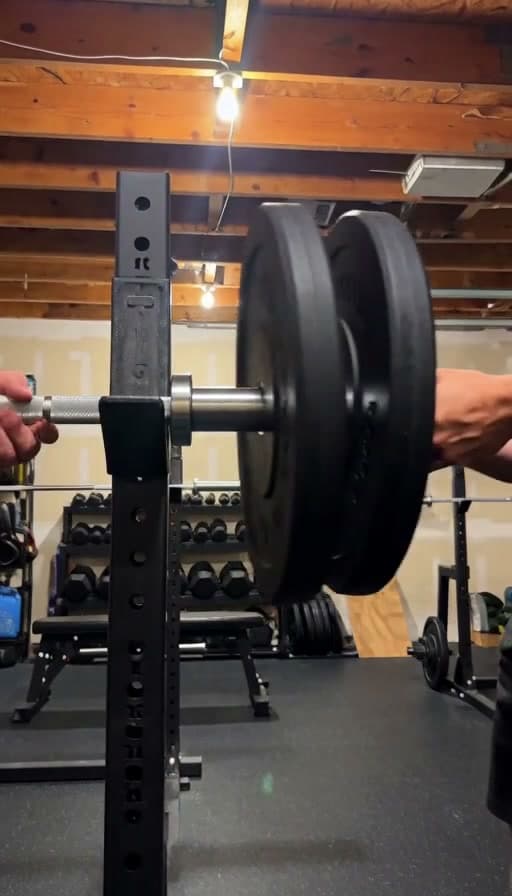 Preview of Barbell loaded with plates for a squat set