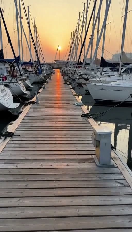 Preview of Harbor boardwalk walked at sunset